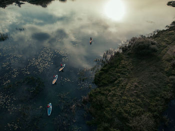 Top view on lake with sup-boards. lake with people floating on boards engaged in sup-surfing. 