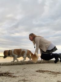 Side view of horse on field against sky