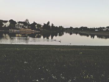 Scenic view of calm lake against clear sky