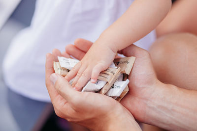 Close-up of hand holding hands