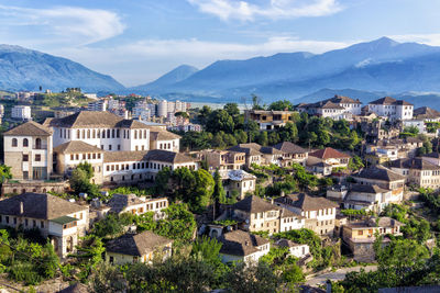 High angle view of townscape and mountains against sky