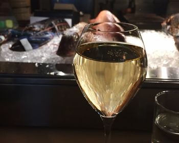 Close-up of wine in glass on table