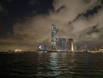 Illuminated city at waterfront