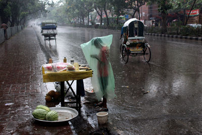 Cars on wet street in rainy season