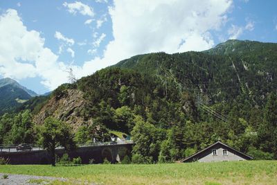 Scenic view of landscape and mountains against sky