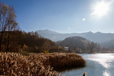 Scenic view of lake and mountains against sky