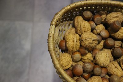 Close-up of nuts in wicker basket at home