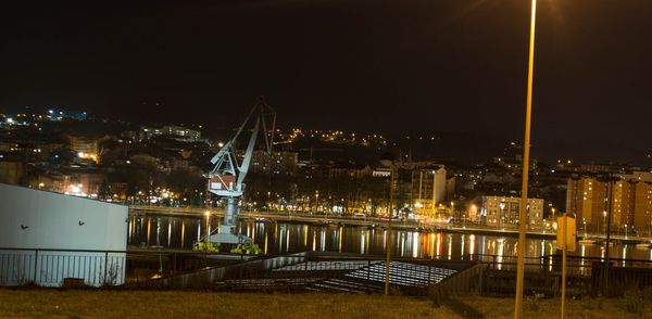 Illuminated buildings in city at night