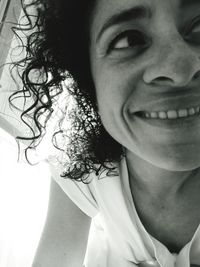 Close-up portrait of a smiling young woman