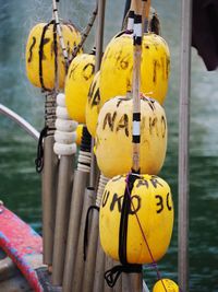 Close-up of yellow lanterns hanging on rope