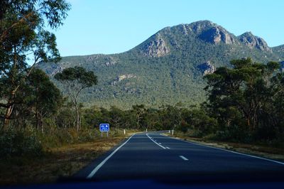 Country road leading towards mountains