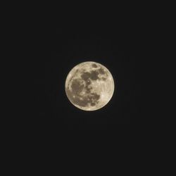 Low angle view of moon against black background