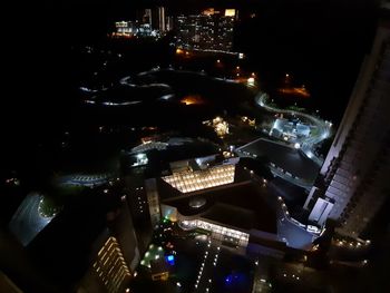 High angle view of city lit up at night