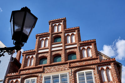 Low angle view of building against blue sky