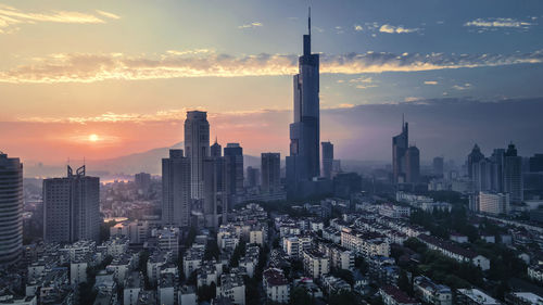 Cityscape against sky during sunset