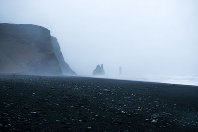 Scenic view of sea against sky during foggy weather