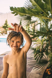 Portrait of shirtless boy in swimming pool