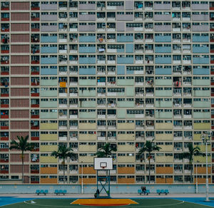 Basketball court against residential building