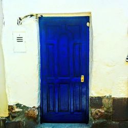 Closed blue door of building