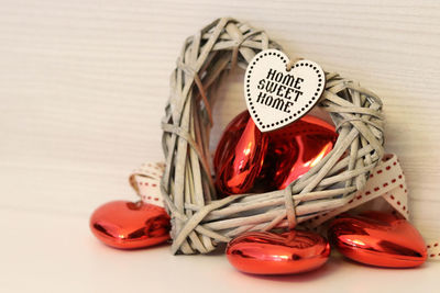 Close-up of red and tied on table