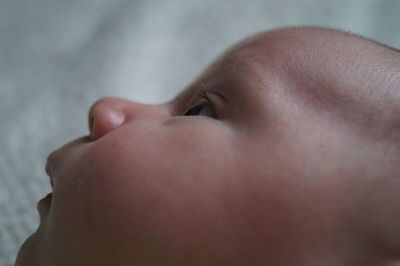 Close-up of baby boy looking away