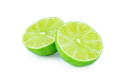 Close-up of lemon slice against white background