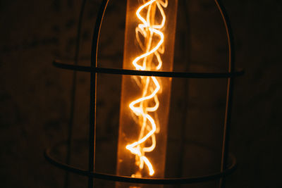 Close-up of illuminated lantern against wall