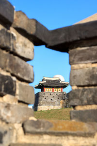 Low angle view of building against blue sky