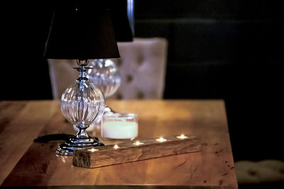 Close-up of lamp  on table