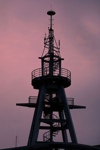 Low angle view of lighthouse against sky during sunset