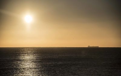 Scenic view of sea against clear sky during sunset