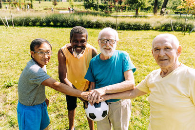 Group of people playing on grassland