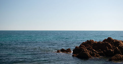 Scenic view of sea against clear sky