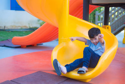 Boy playing in playground