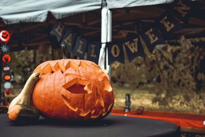 Close-up of pumpkin against orange background