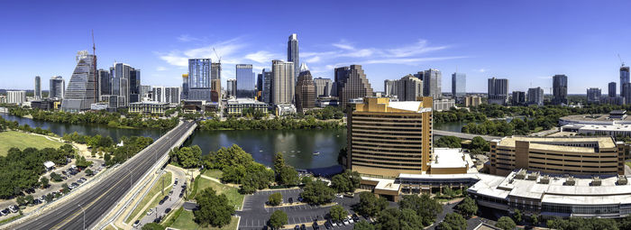 Panoramic view of buildings in city against sky