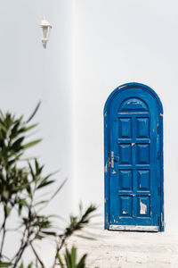 Low angle view of blue wall