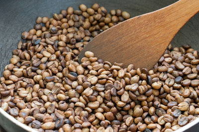 High angle view of coffee beans in container