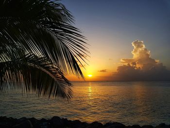 Scenic view of sea against sky at sunset