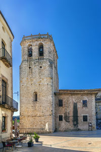 View of old building against clear blue sky