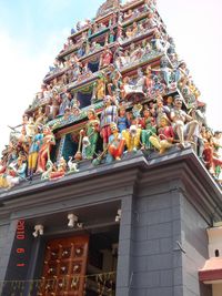 Low angle view of temple against building