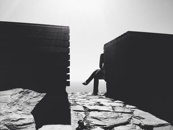 Full length of woman standing on wall