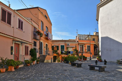 A narrow street between old houses in melfi, a medieval village of basilicata region.