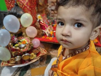 Close-up portrait of cute baby looking away