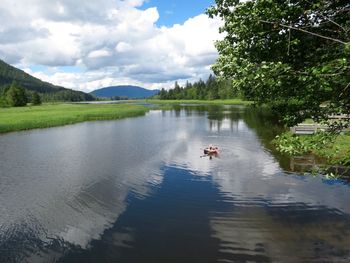 Reflection of clouds in calm lake