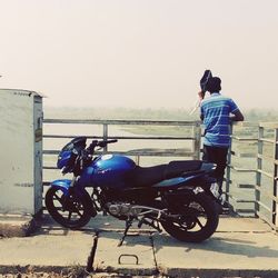 Rear view of man riding bicycle