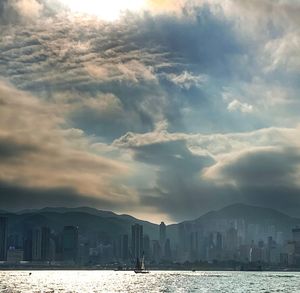 Scenic view of sea and buildings against sky