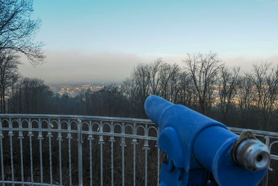 Close-up of railing against trees