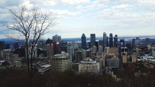 High angle view of buildings in city against sky