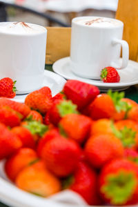 Close-up of strawberries in plate on table